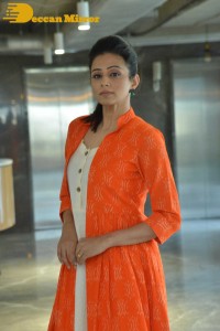 Priyamani photoshoot in a white dress and orange overall jacket