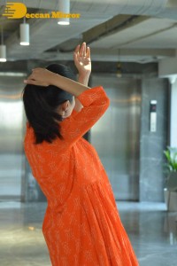 Priyamani photoshoot in a white dress and orange overall jacket