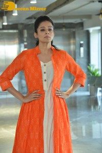 Priyamani photoshoot in a white dress and orange overall jacket
