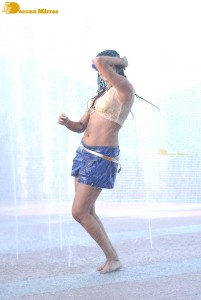 Actress Priyamani glamorous pictures in rain wearing a blue mini skirt