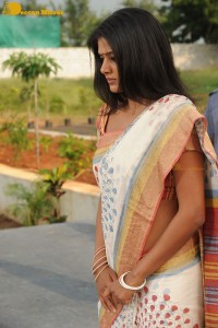 Priyamani in a white saree on the sets of a film shoot