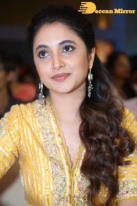 Actress Priyanka Arul Mohan in a yellow dress while attending a movie event