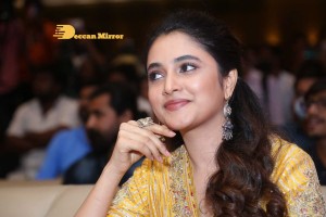 Actress Priyanka Arul Mohan in a yellow dress while attending a movie event