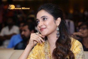 Actress Priyanka Arul Mohan in a yellow dress while attending a movie event