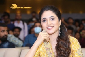 Actress Priyanka Arul Mohan in a yellow dress while attending a movie event