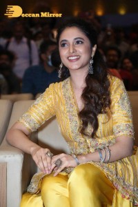 Actress Priyanka Arul Mohan in a yellow dress while attending a movie event