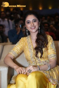 Actress Priyanka Arul Mohan in a yellow dress while attending a movie event