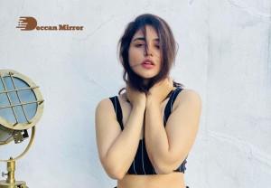 Actress Priyanka Jawalkra posing for a Photoshoot in Black Saree