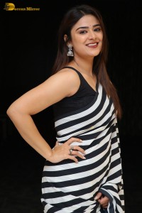 Tollywood Actress Priyanka Sharma in a black and white saree