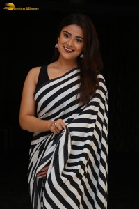 Tollywood Actress Priyanka Sharma in a black and white saree