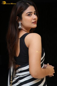 Tollywood Actress Priyanka Sharma in a black and white saree