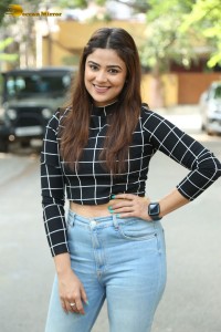 Actress Priyanka Sharma in a black shirt and denim jeans