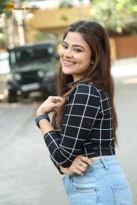 Actress Priyanka Sharma in a black shirt and denim jeans