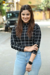 Actress Priyanka Sharma in a black shirt and denim jeans