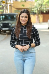 Actress Priyanka Sharma in a black shirt and denim jeans