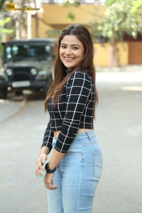 Actress Priyanka Sharma in a black shirt and denim jeans