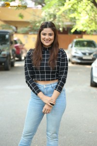 Actress Priyanka Sharma in a black shirt and denim jeans
