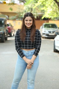 Actress Priyanka Sharma in a black shirt and denim jeans