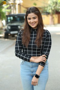 Actress Priyanka Sharma in a black shirt and denim jeans