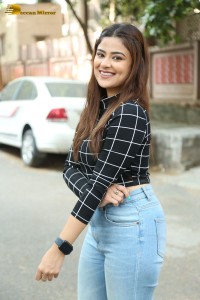 Actress Priyanka Sharma in a black shirt and denim jeans