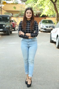 Actress Priyanka Sharma in a black shirt and denim jeans