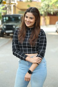 Actress Priyanka Sharma in a black shirt and denim jeans