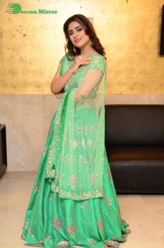 Bollywood and Telugu Cinema Actress Priyanka Sharma in a green dress