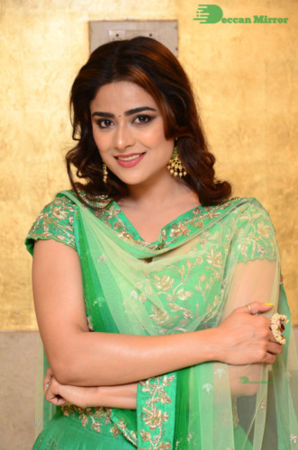 Bollywood and Telugu Cinema Actress Priyanka Sharma in a green dress