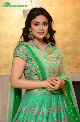 Bollywood and Telugu Cinema Actress Priyanka Sharma in a green dress