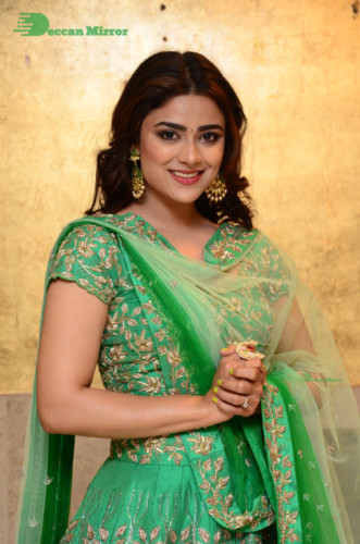Bollywood and Telugu Cinema Actress Priyanka Sharma in a green dress