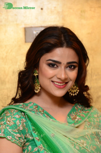 Bollywood and Telugu Cinema Actress Priyanka Sharma in a green dress