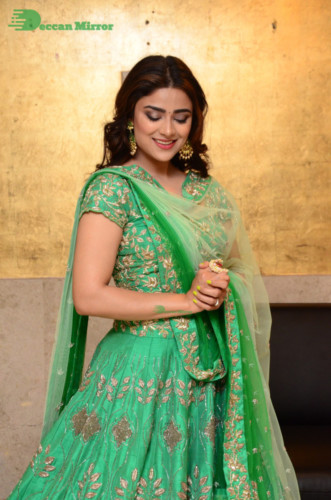 Bollywood and Telugu Cinema Actress Priyanka Sharma in a green dress