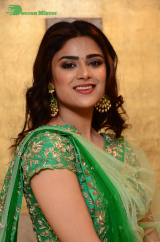 Bollywood and Telugu Cinema Actress Priyanka Sharma in a green dress