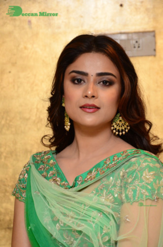 Bollywood and Telugu Cinema Actress Priyanka Sharma in a green dress