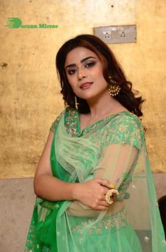 Bollywood and Telugu Cinema Actress Priyanka Sharma in a green dress