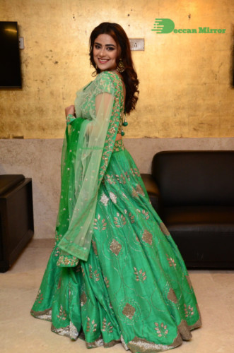 Bollywood and Telugu Cinema Actress Priyanka Sharma in a green dress