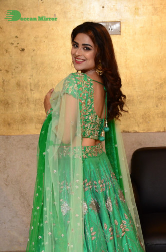 Bollywood and Telugu Cinema Actress Priyanka Sharma in a green dress