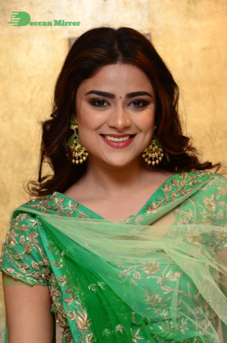 Bollywood and Telugu Cinema Actress Priyanka Sharma in a green dress
