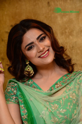 Bollywood and Telugu Cinema Actress Priyanka Sharma in a green dress