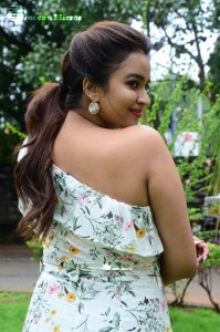 Actress Pujita Ponnada poses in a white floral dress for a photoshoot
