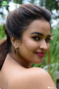 Actress Pujita Ponnada poses in a white floral dress for a photoshoot