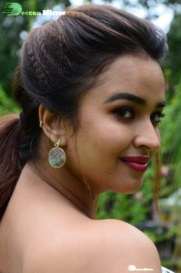 Actress Pujita Ponnada poses in a white floral dress for a photoshoot