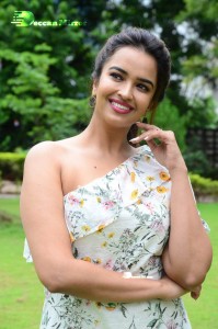 Actress Pujita Ponnada poses in a white floral dress for a photoshoot