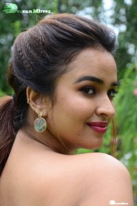 Actress Pujita Ponnada poses in a white floral dress for a photoshoot