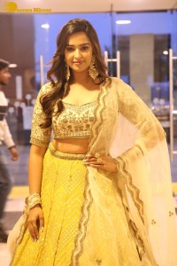 Actress Pujita Ponnada in a yellow dress while attending a movie function