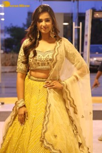 Actress Pujita Ponnada in a yellow dress while attending a movie function