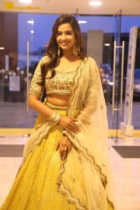 Actress Pujita Ponnada in a yellow dress while attending a movie function
