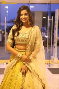 Actress Pujita Ponnada in a yellow dress while attending a movie function