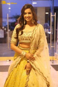 Actress Pujita Ponnada in a yellow dress while attending a movie function