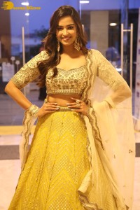 Actress Pujita Ponnada in a yellow dress while attending a movie function